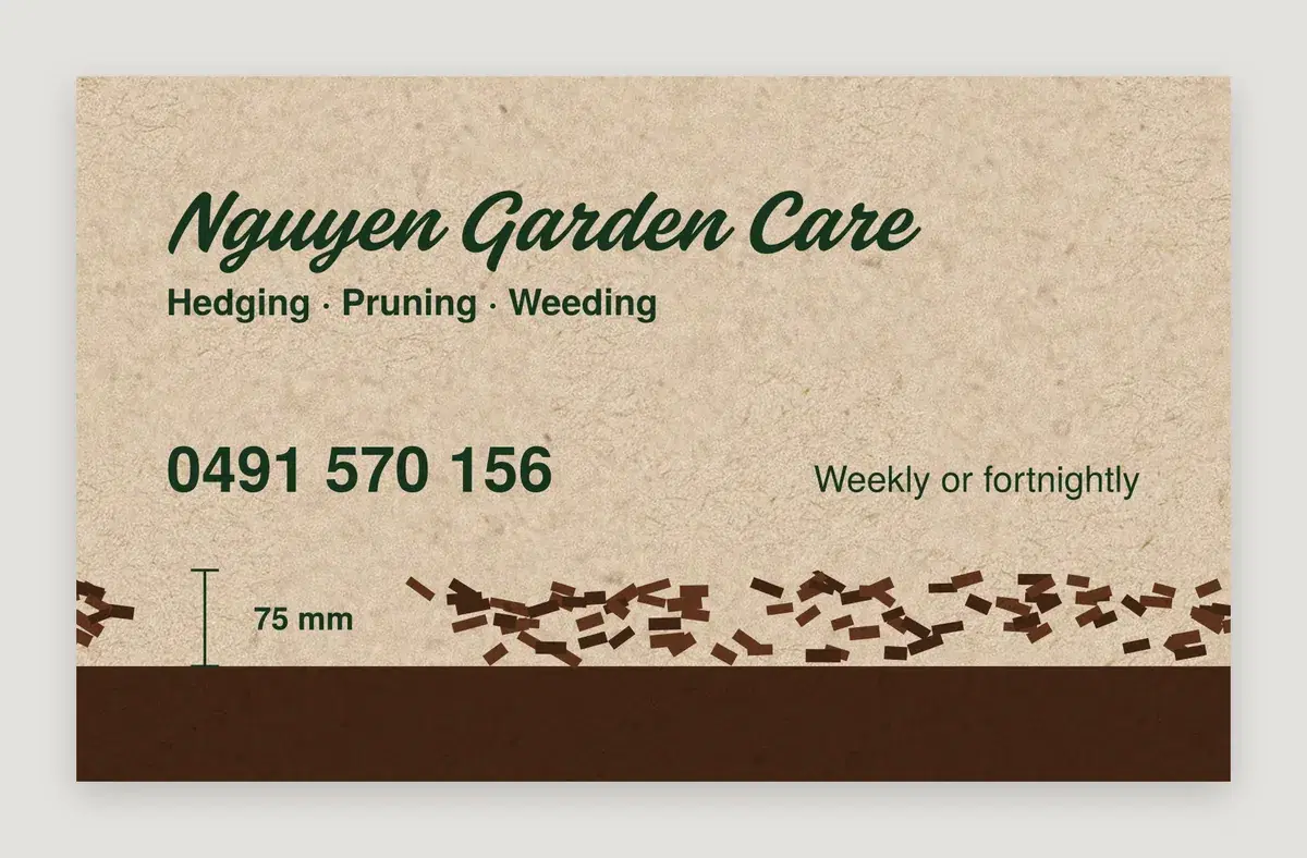 Kraft lawn mowing and landscaping business card, garden bed section with bark chips over a soil band, front, 90 x 55 mm