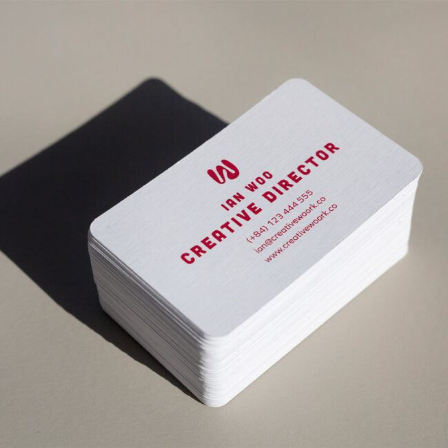 Business cards on white linen stock · white linen stock · full-colour digital print · matte finish · rounded corners