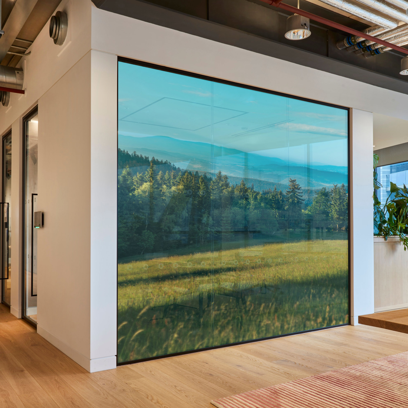 One-way window graphics mockup showing perforated vinyl window sticker for retail