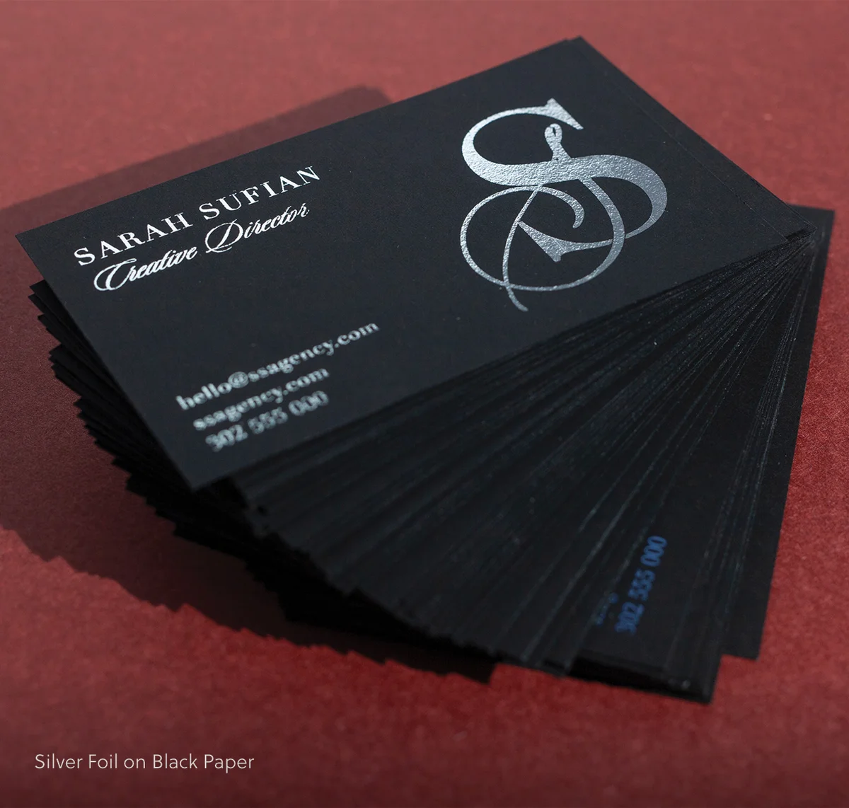 Flat foil business cards fanned out - premium finish options from Printshop