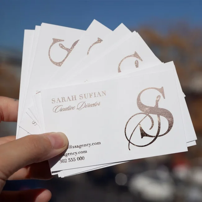 Rose gold foil business cards on white · white 350gsm smooth stock · full-colour digital print · rose gold flat foil