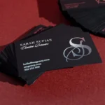 Black business cards with silver foil · true-black uncoated coloured stock · full-colour digital print · silver flat foil