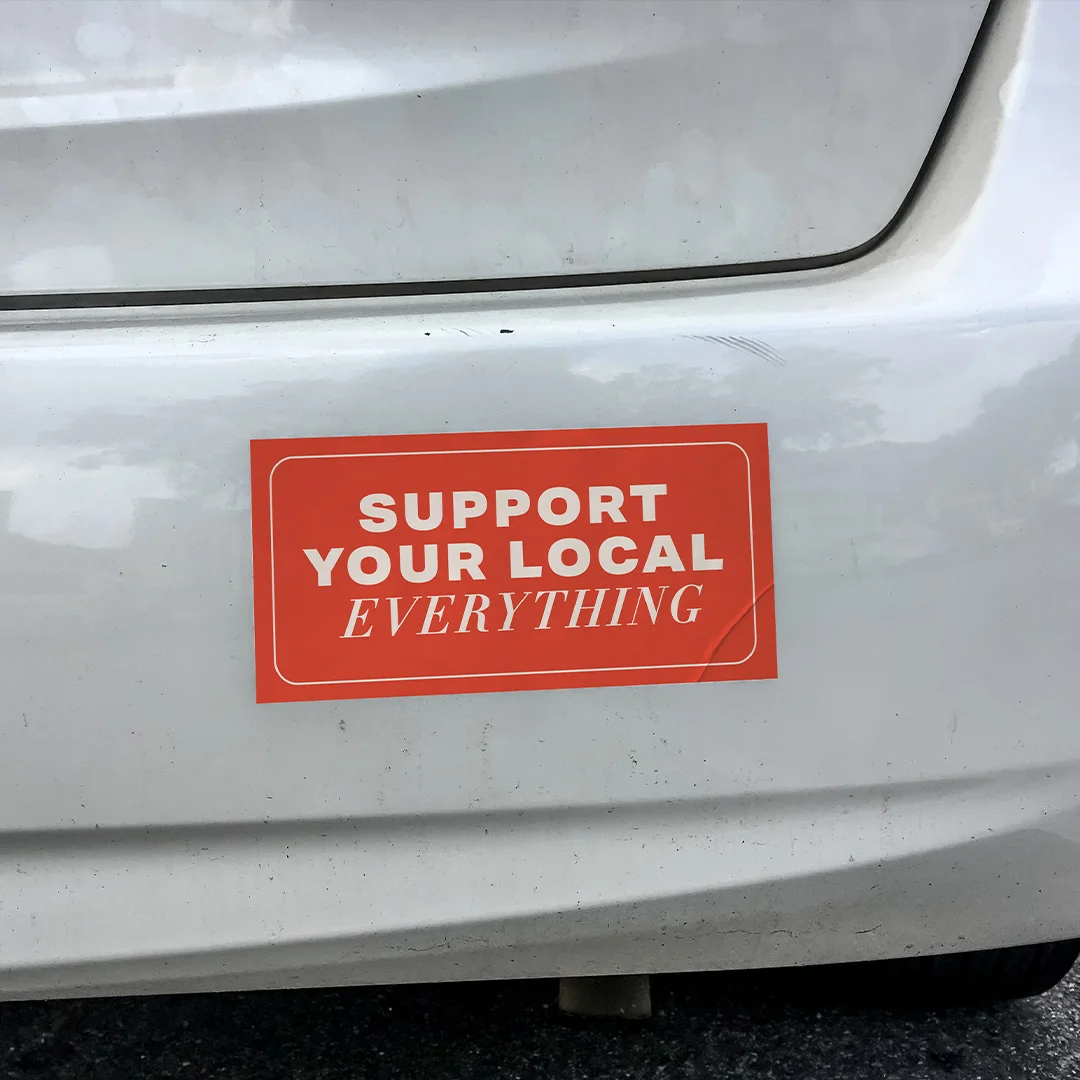 Bumper sticker applied to car rear bumper