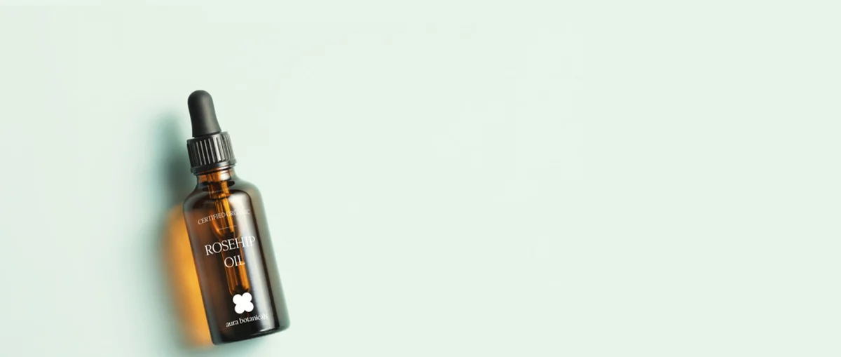 Clear sticker label on rosehip oil product bottle