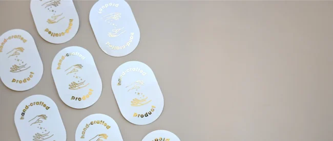 Gold foil oval stickers with hand-crafted design