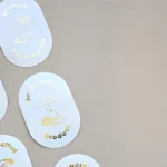 Gold foil handcrafted sticker showing premium die-cut label quality