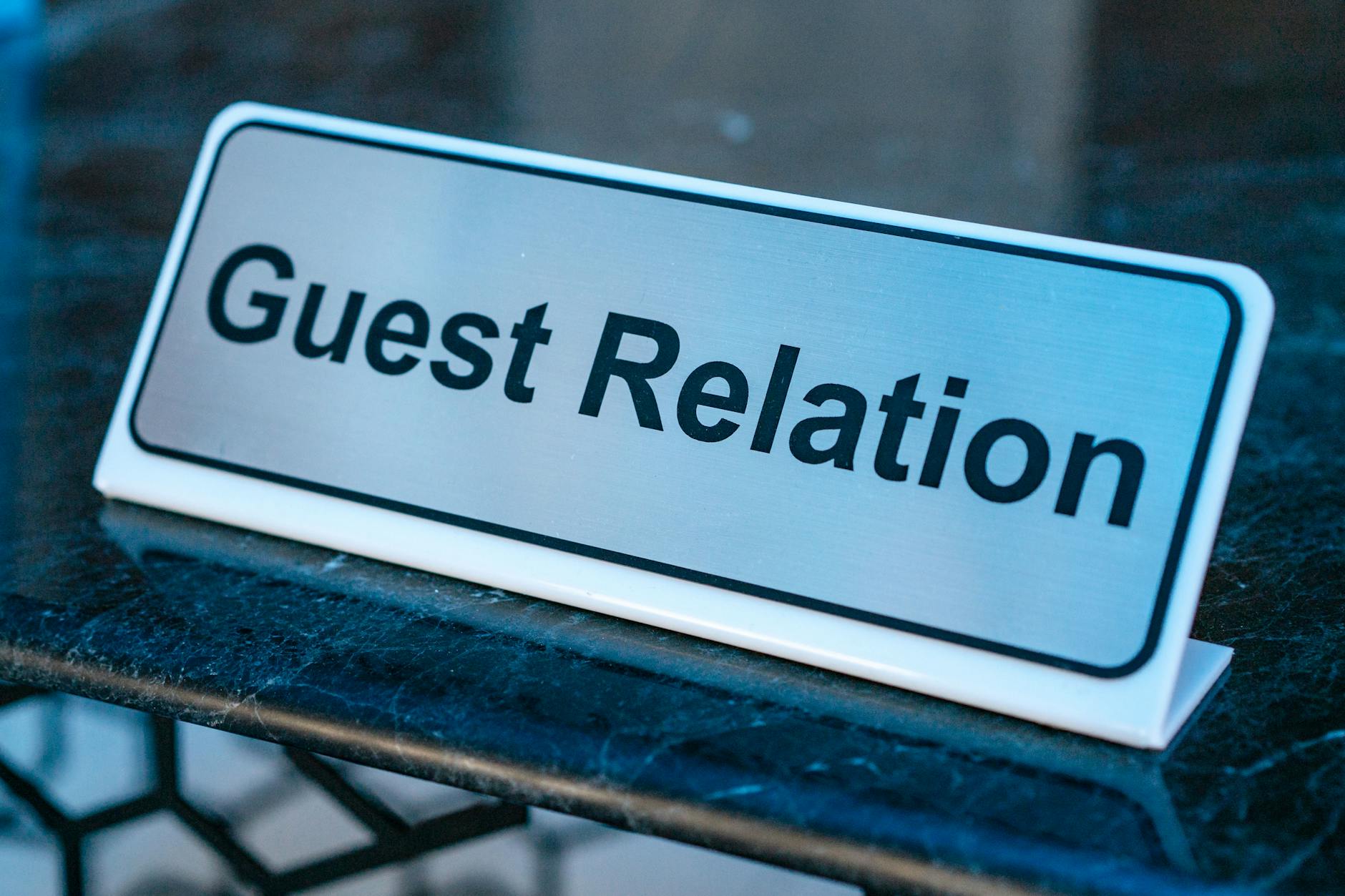 Printed acrylic panel sign in a modern office reception area with natural light