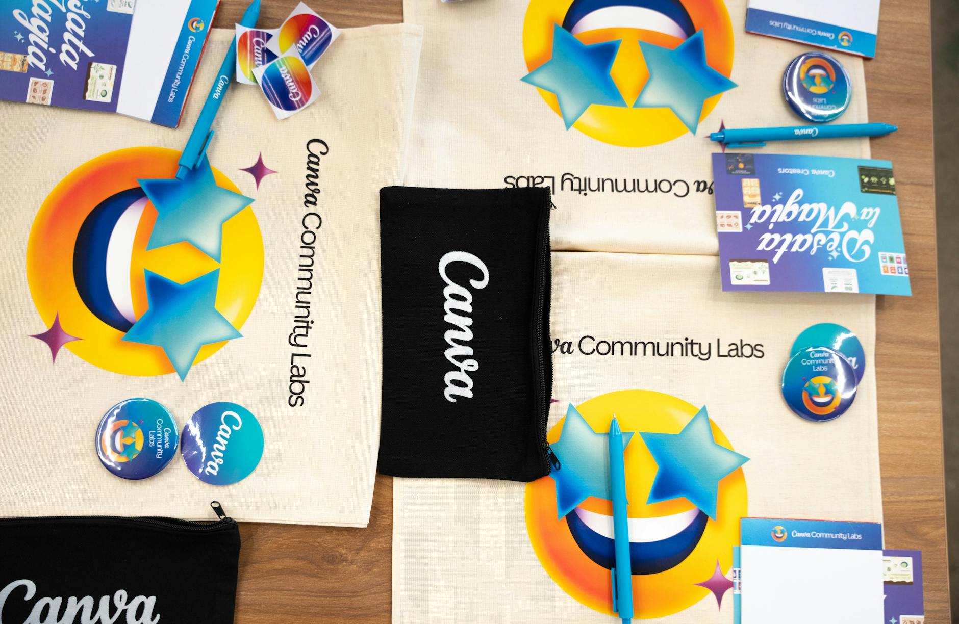 A flat-lay showing branded stickers arranged in a promotional kit with kraft tissue paper and a thank-you card, styled as a premium unboxing