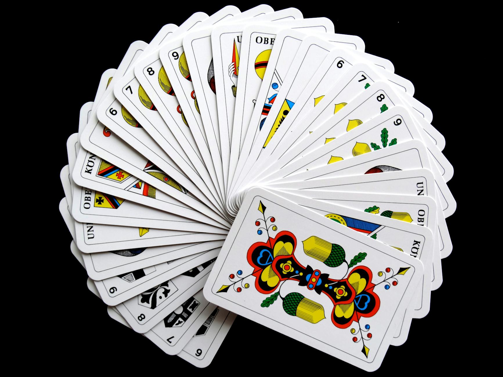fan arrangement of business cards for five different team members showing identical branding layout with individual names and job titles, pr