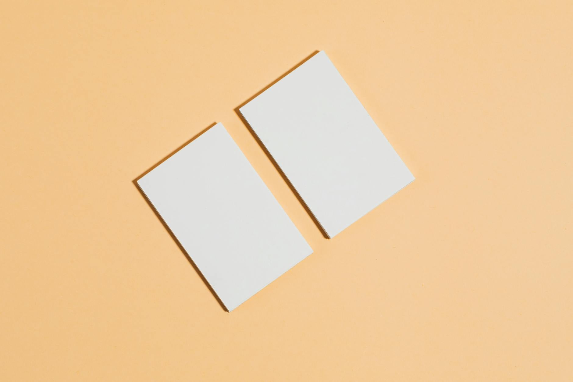 Flat-lay arrangement of six business cards representing different consulting specialisations - each showing a distinct professional finish a