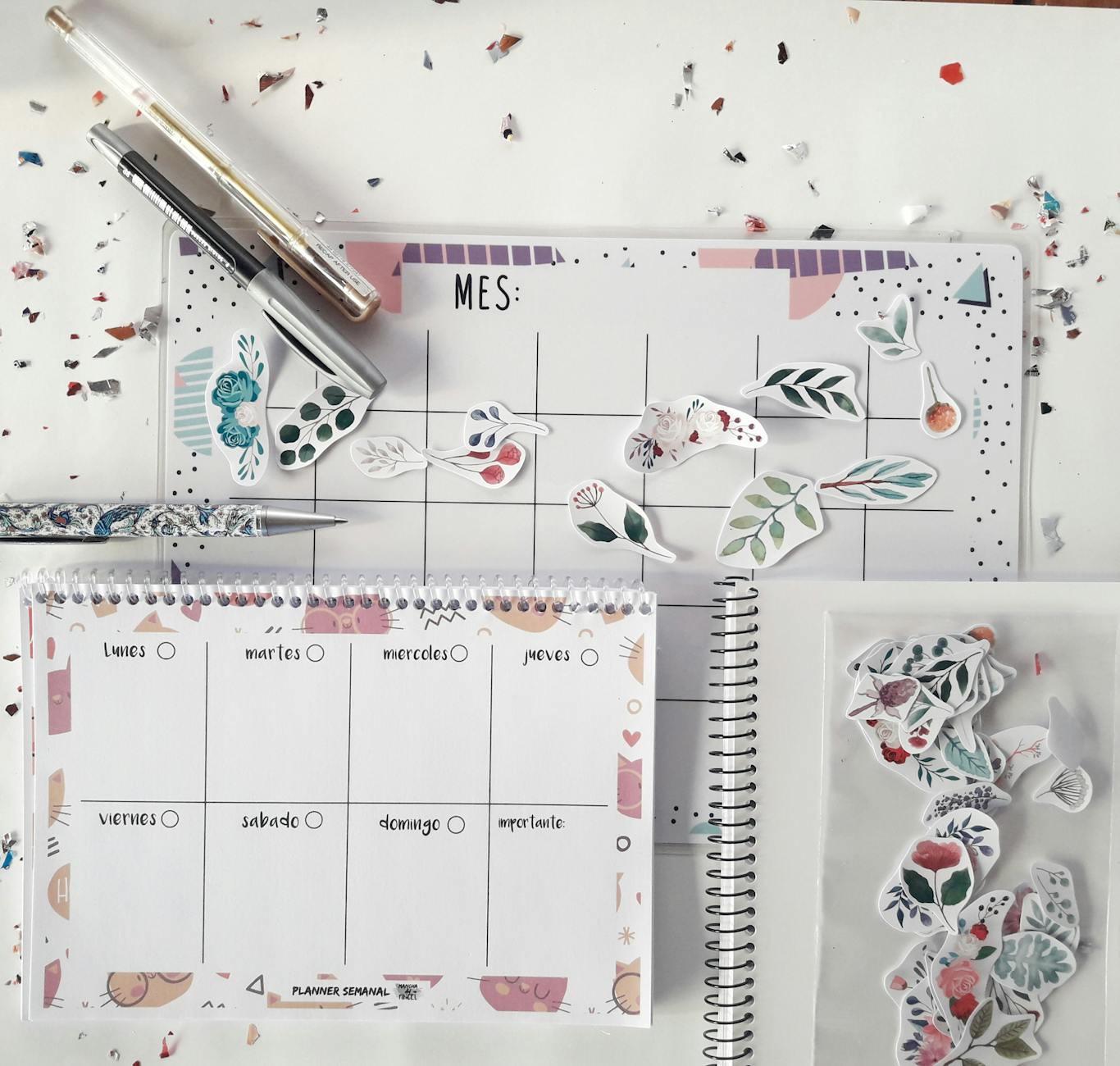 three planner sticker sheet sizes A4 A5 A6 arranged side by side on white desk with ruler showing dimensions