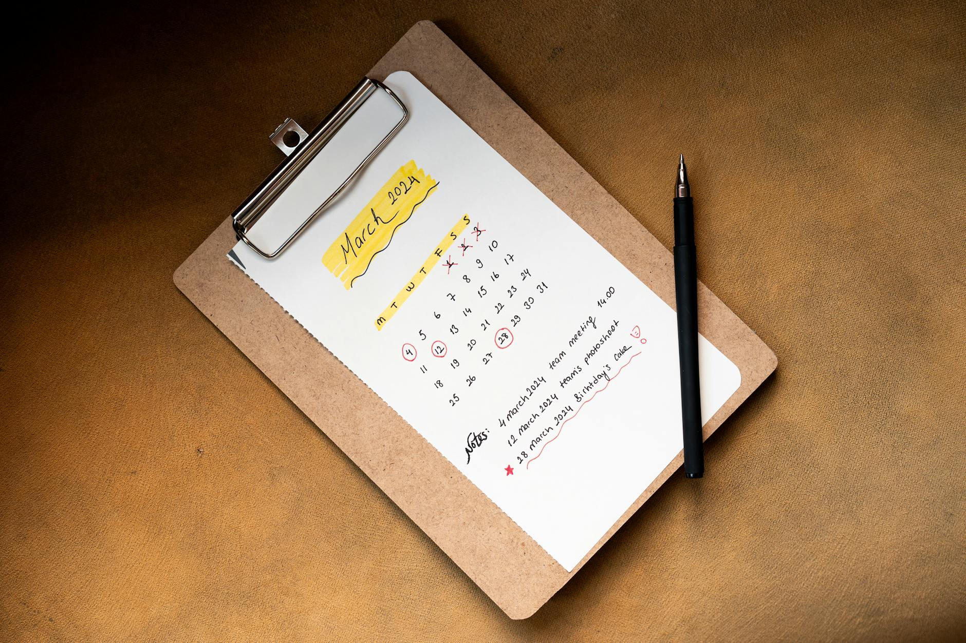 flat-lay of planner sticker sheet featuring date headers habit tracker dots and botanical decorative accents arranged on open journal page