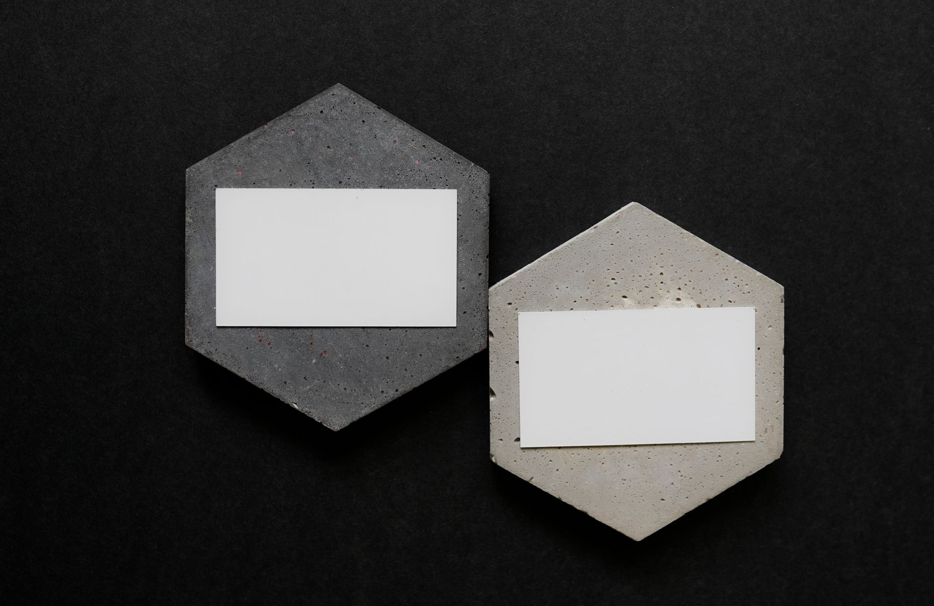 Side-by-side comparison of two business card designs showing front-placement QR code in bottom-right corner versus a centred back-placement