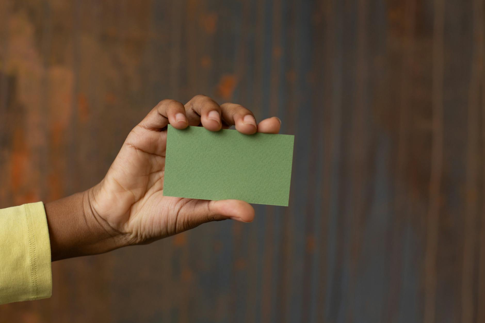 Stack of square business cards fresh off the press showing clean cut edges and consistent thickness