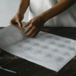 a business sticker sheet with multiple brand designs visible - circular seals, rectangular product labels and logo die-cut stickers in brand