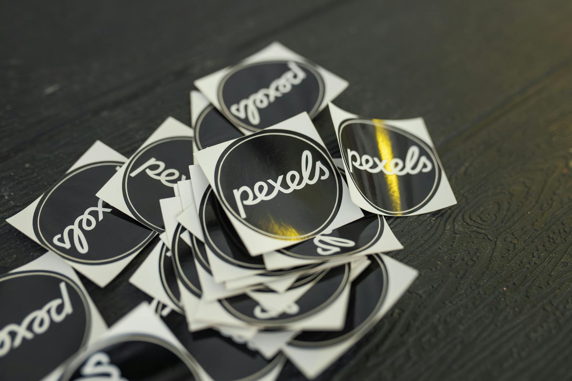 a printed sticker with a white border edge visible on one side and text too close to the cut line on another side, illustrating common templ