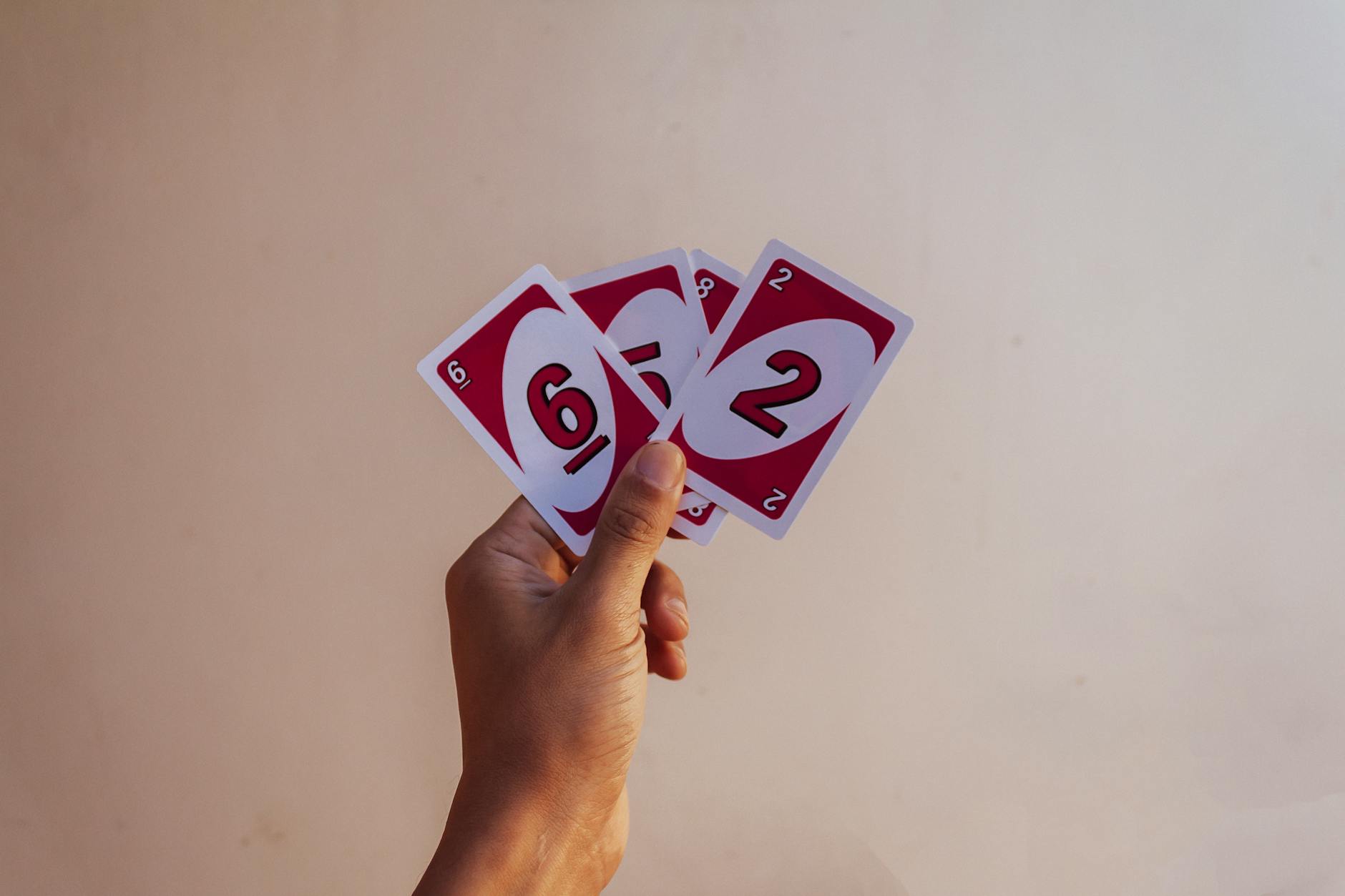 three vertical business card designs side by side as a flat lay, minimalist typography, bold colour block, and photo-background styles, stud