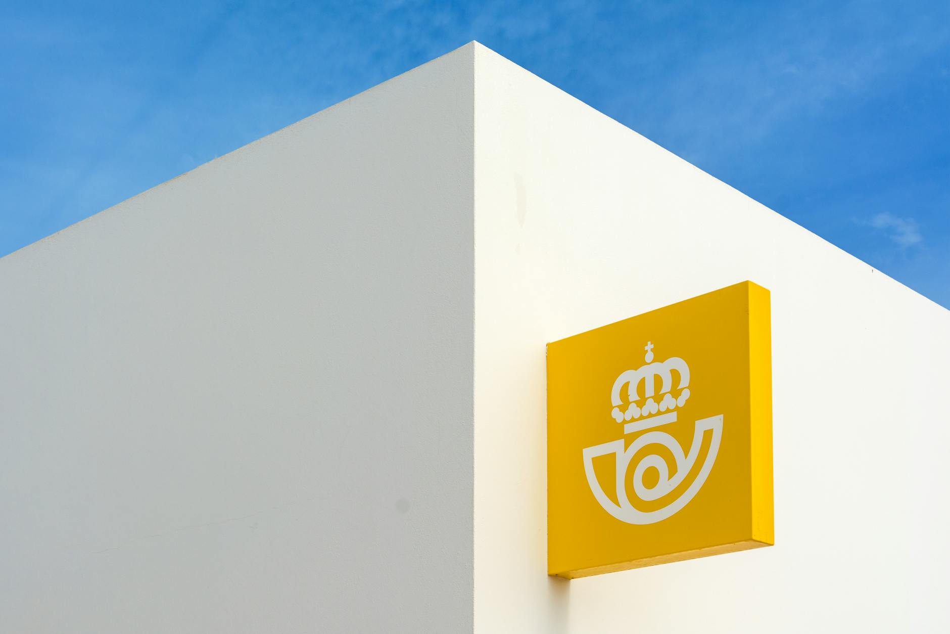 A side-by-side flat-lay comparison showing an A1 acrylic reception sign panel next to an A2 panel, both printed with a mock business logo