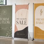 A retractable pull-up banner, an X-banner frame and a telescopic banner stand side by side, comparing the three banner stand types.
