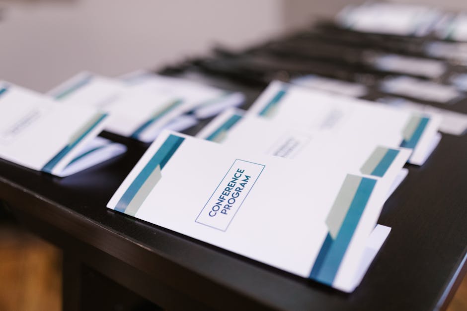 Printed saddle-stitched booklets neatly arranged on a table