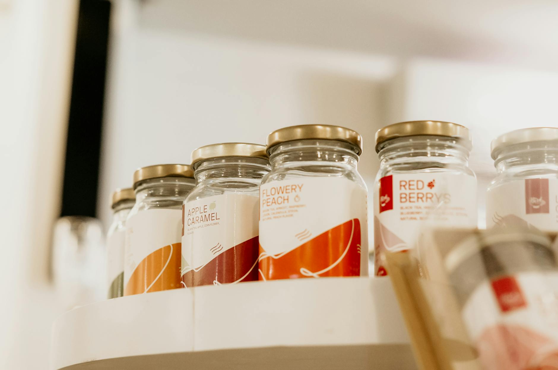 Printed product labels on a roll, showing repeated branded labels ready to apply.