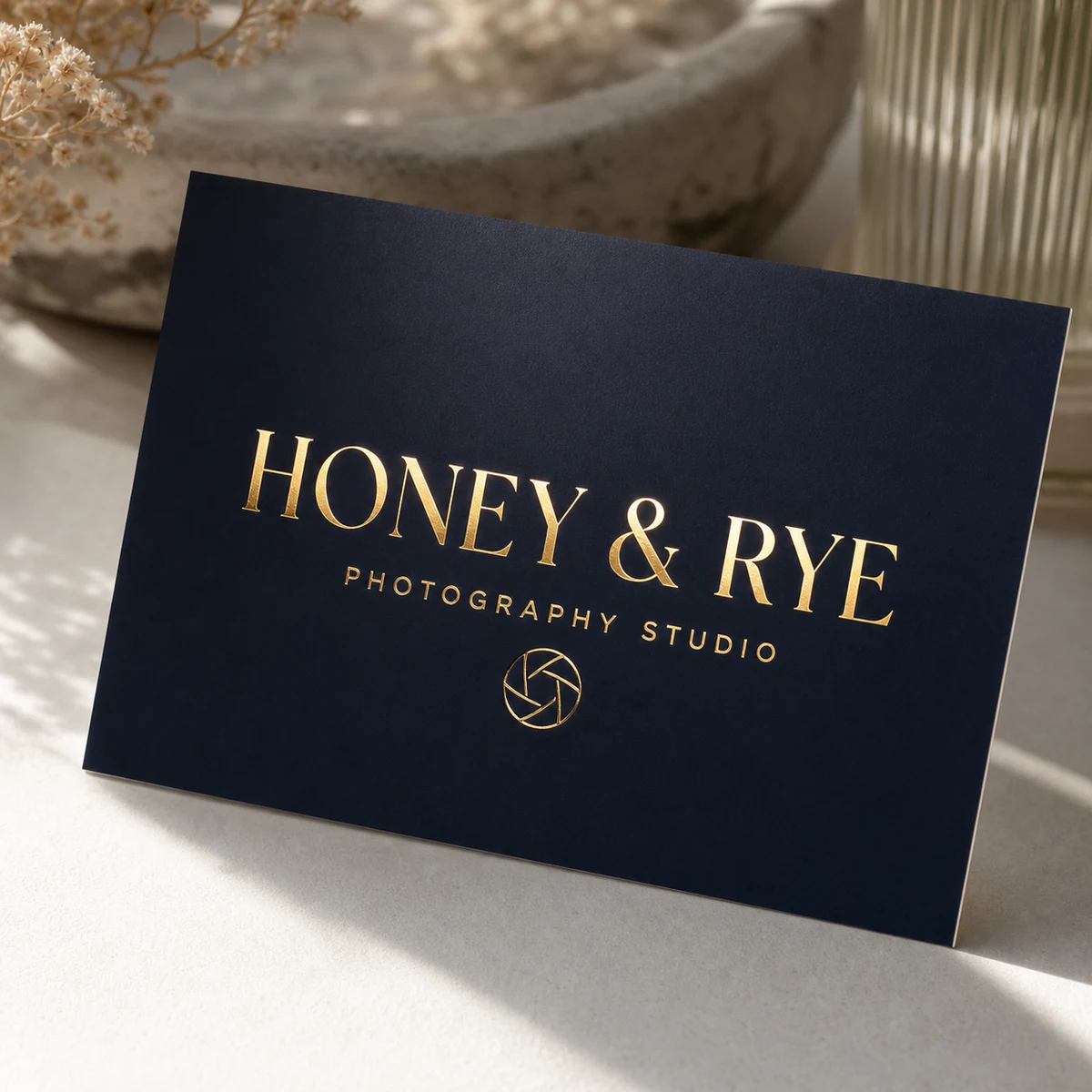 Photographer business card, deep navy · 350gsm matte stock · full-colour digital print · gold flat foil on logo