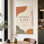 A bold-graphic A1 synthetic poster mounted flat on a modern Australian cafe wall with a customer at a table in the background showing viewing distance, sharp text, warm natural light