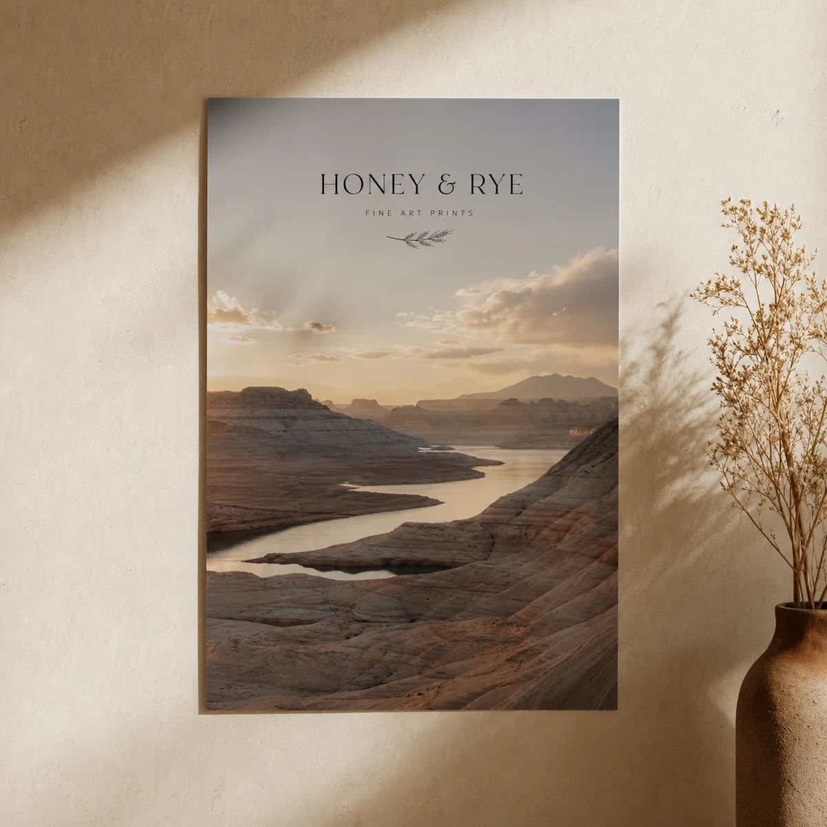 Close-up of an A3 landscape photographic poster showing fine tonal gradation in deep shadow areas with smooth gradation and no banding, warm gallery wall setting