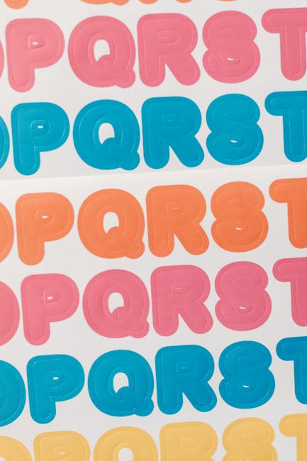 Colorful printed die-cut sticker sheets with alphabet letters on a white background