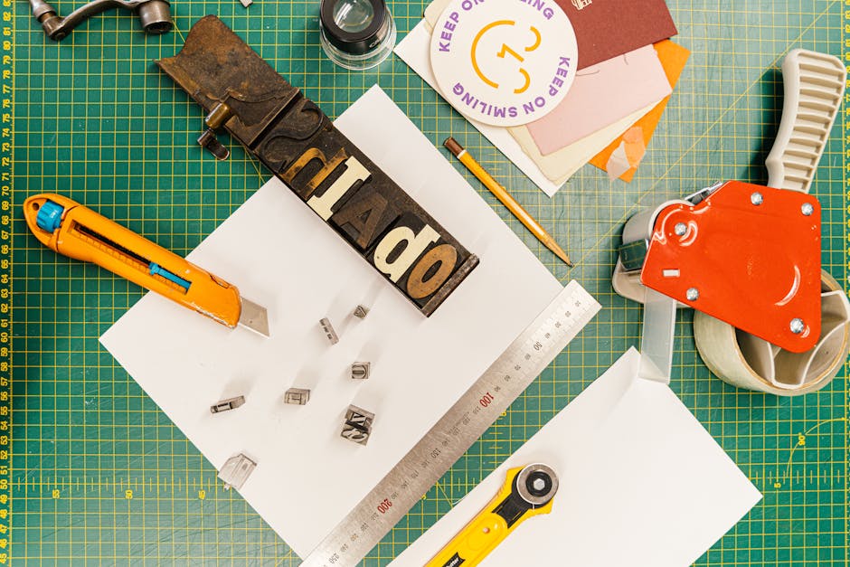 A crafting desk with printed sticker sheets and paper supplies