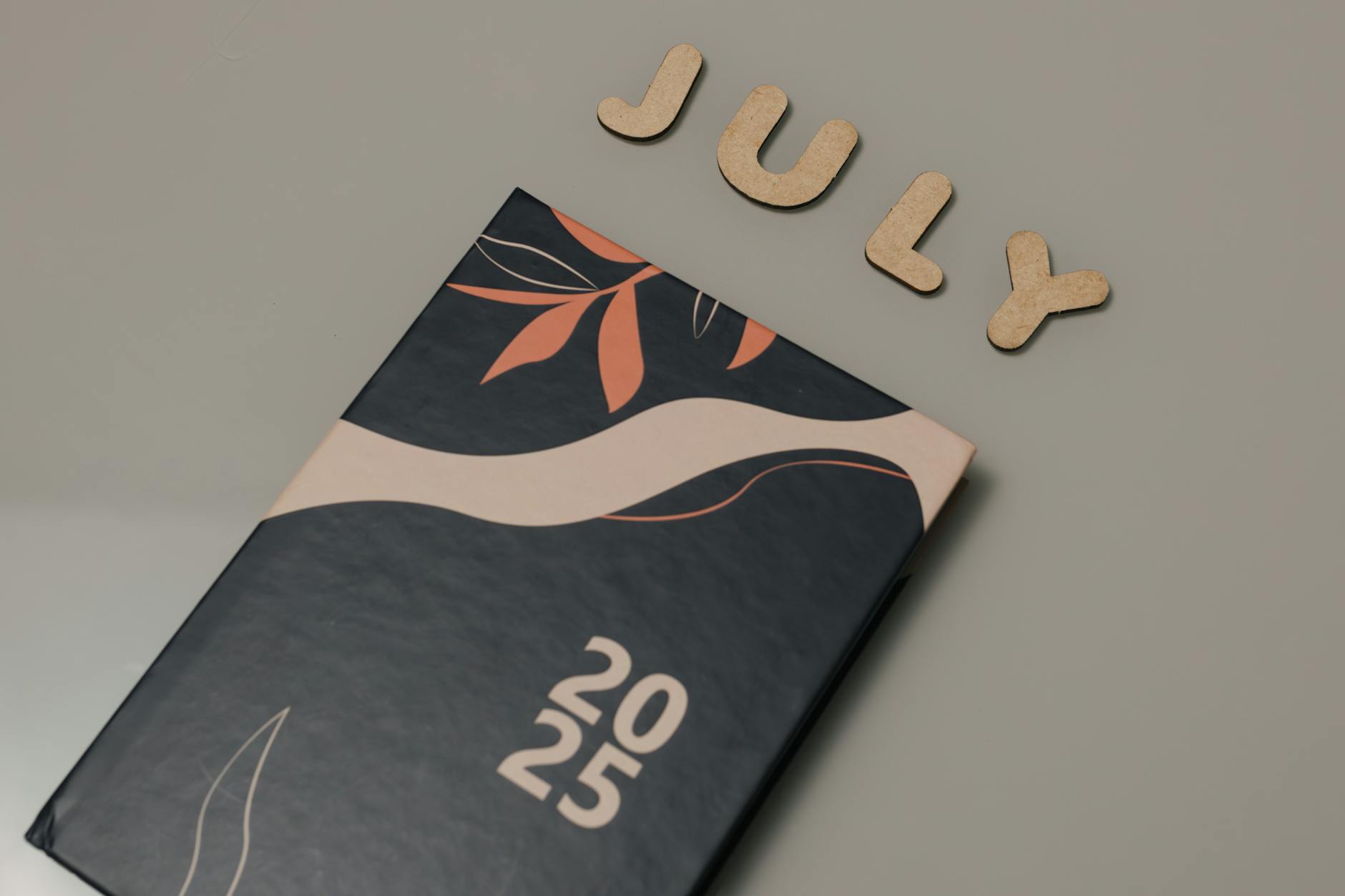 close-up of a matte-laminated corporate booklet cover showing clean typography and a company logo
