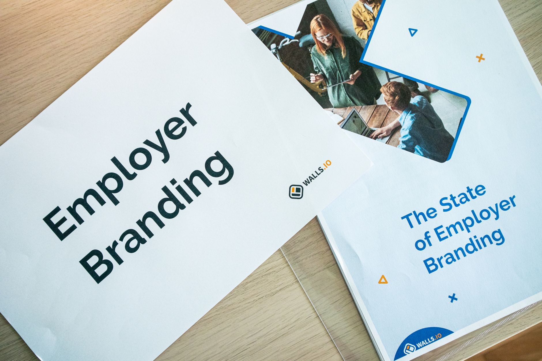 printed corporate brochures laid out on a meeting table