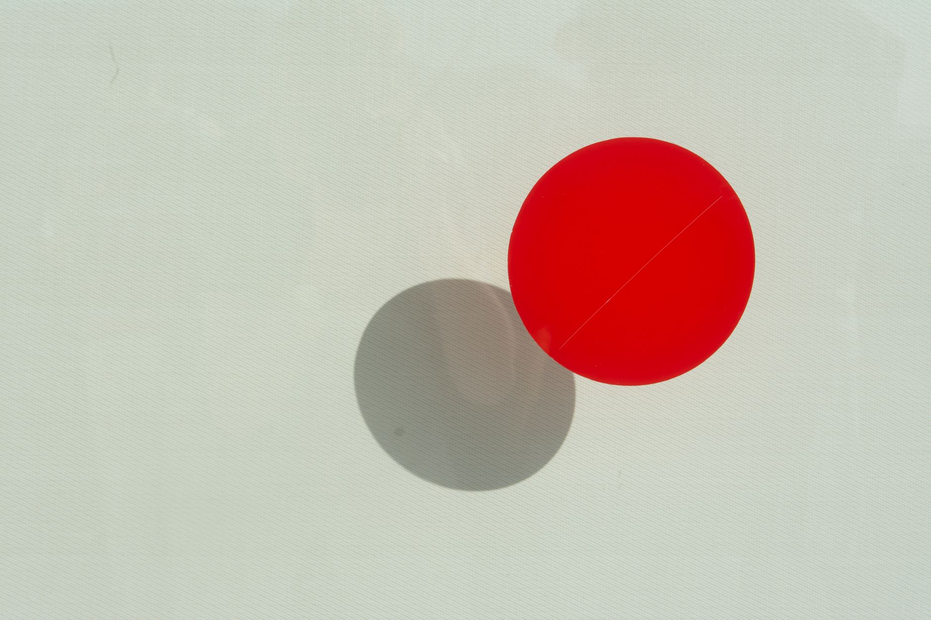 round red and grey dot stickers on a white surface