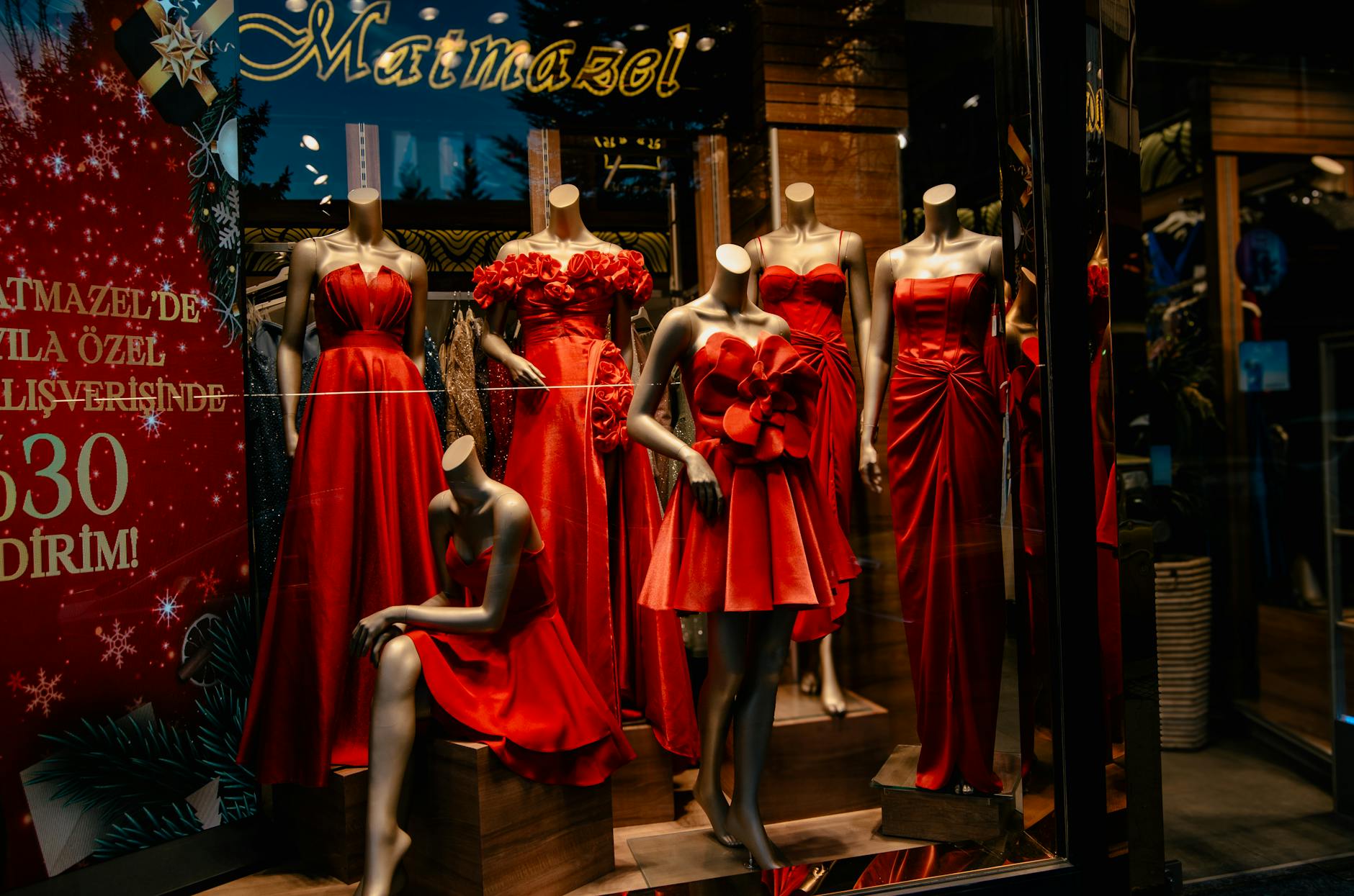 a festive storefront display with a holiday sale callout