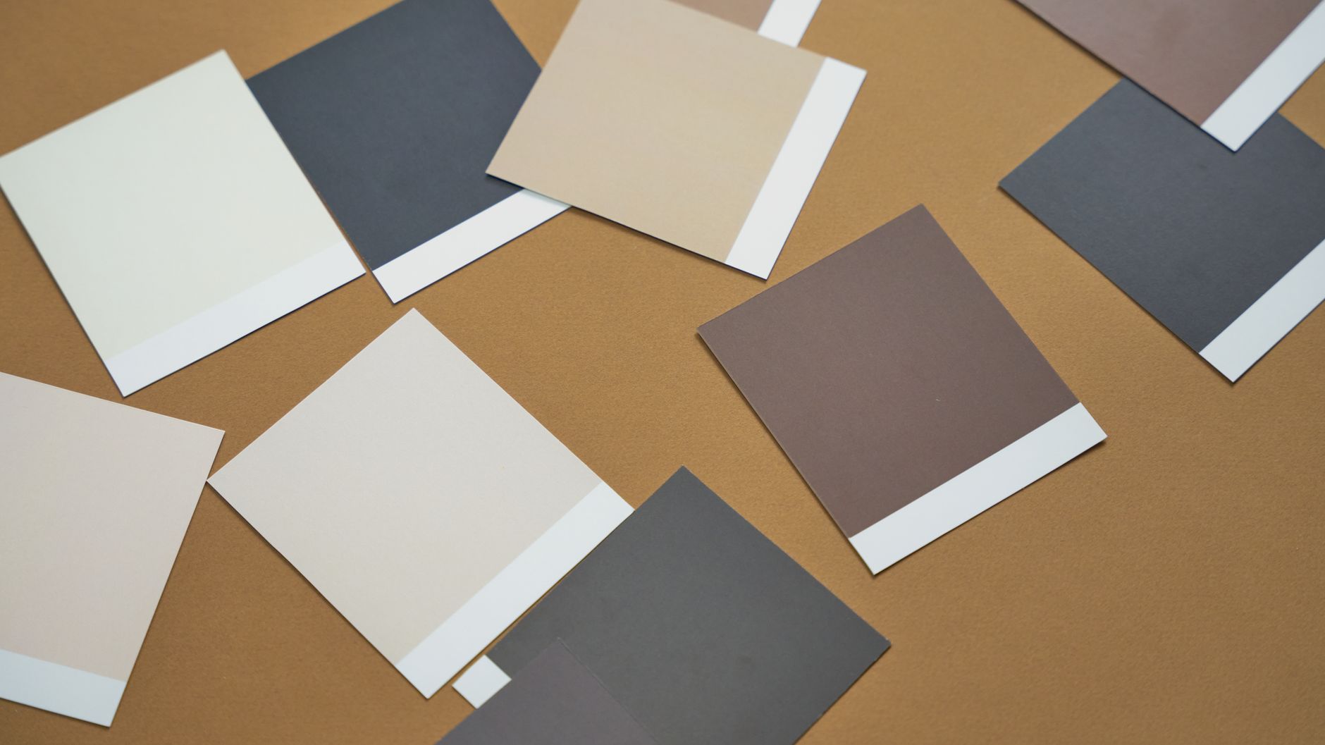 close-up of gloss and matte flyer samples at 115gsm and 170gsm side by side, showing the difference in surface sheen and paper body