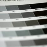 Side-by-side print swatch showing an RGB neon blue next to its CMYK-converted equivalent, both labelled, illustrating visible colour shift