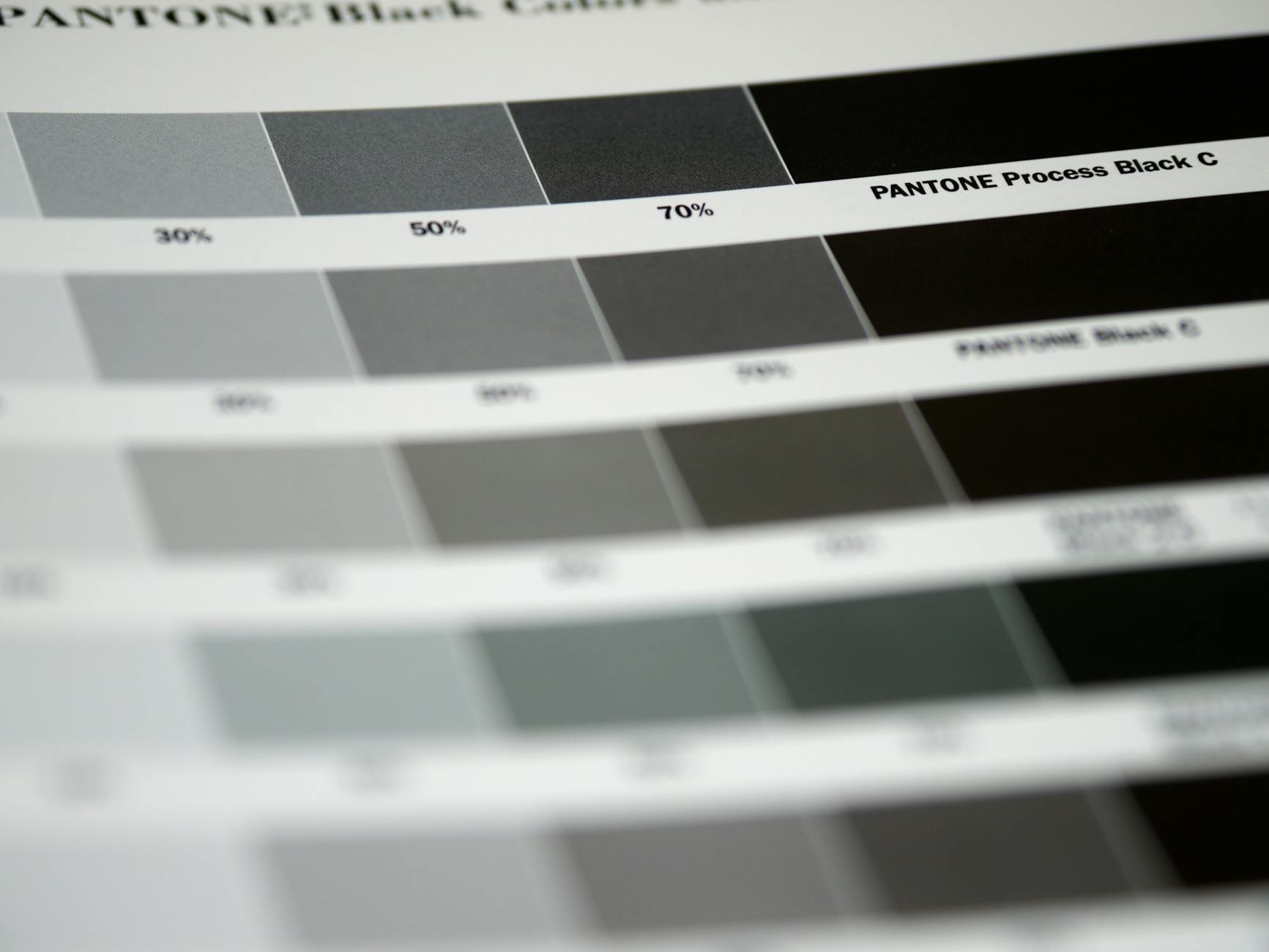Side-by-side print swatch showing an RGB neon blue next to its CMYK-converted equivalent, both labelled, illustrating visible colour shift