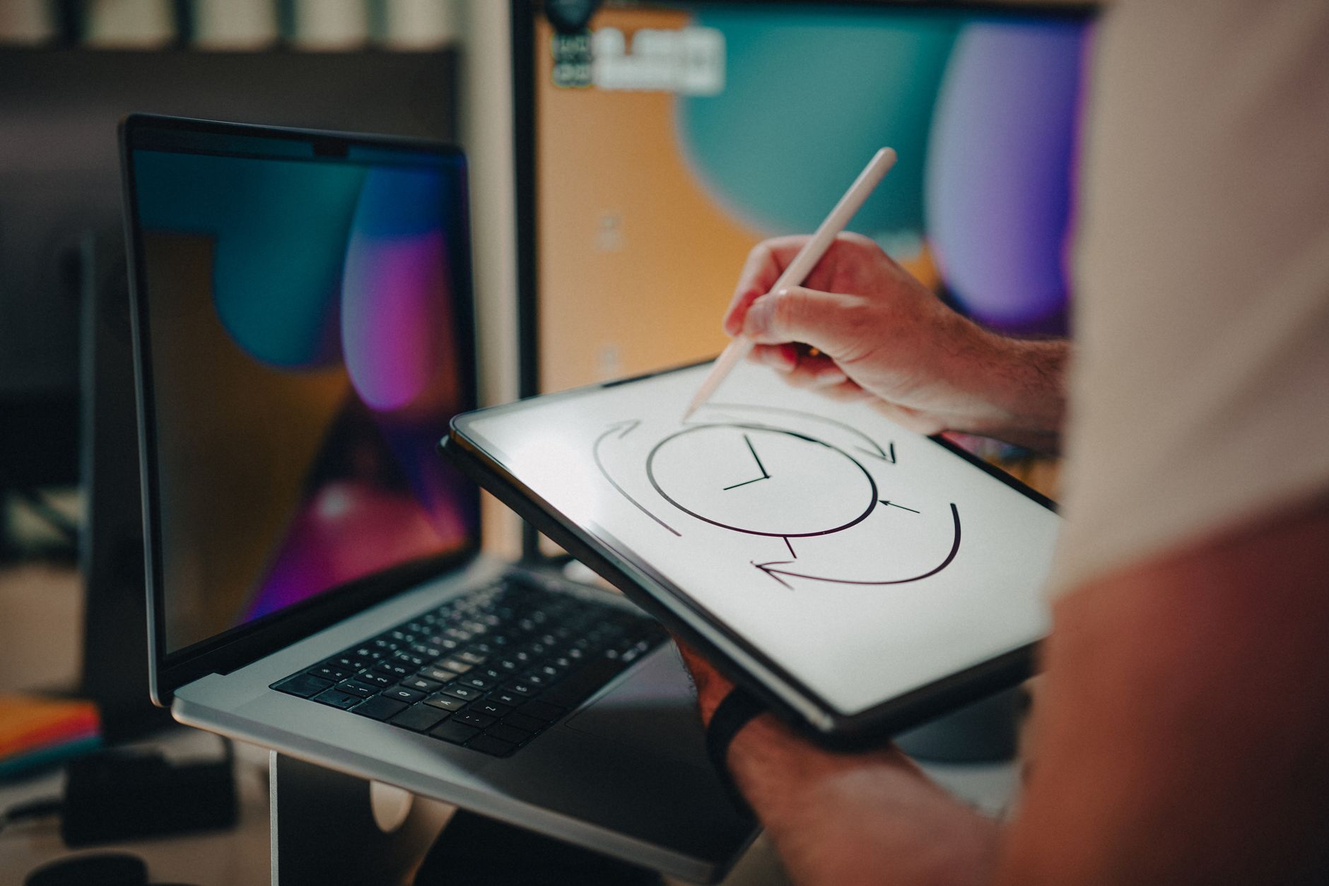 a designer sketching artwork on a graphics tablet