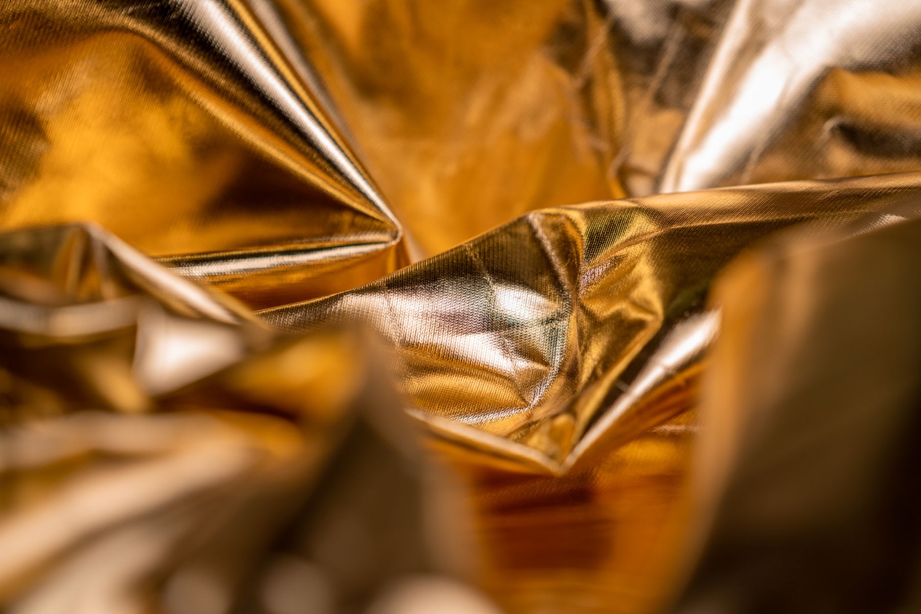 a close-up of glossy gold foil texture