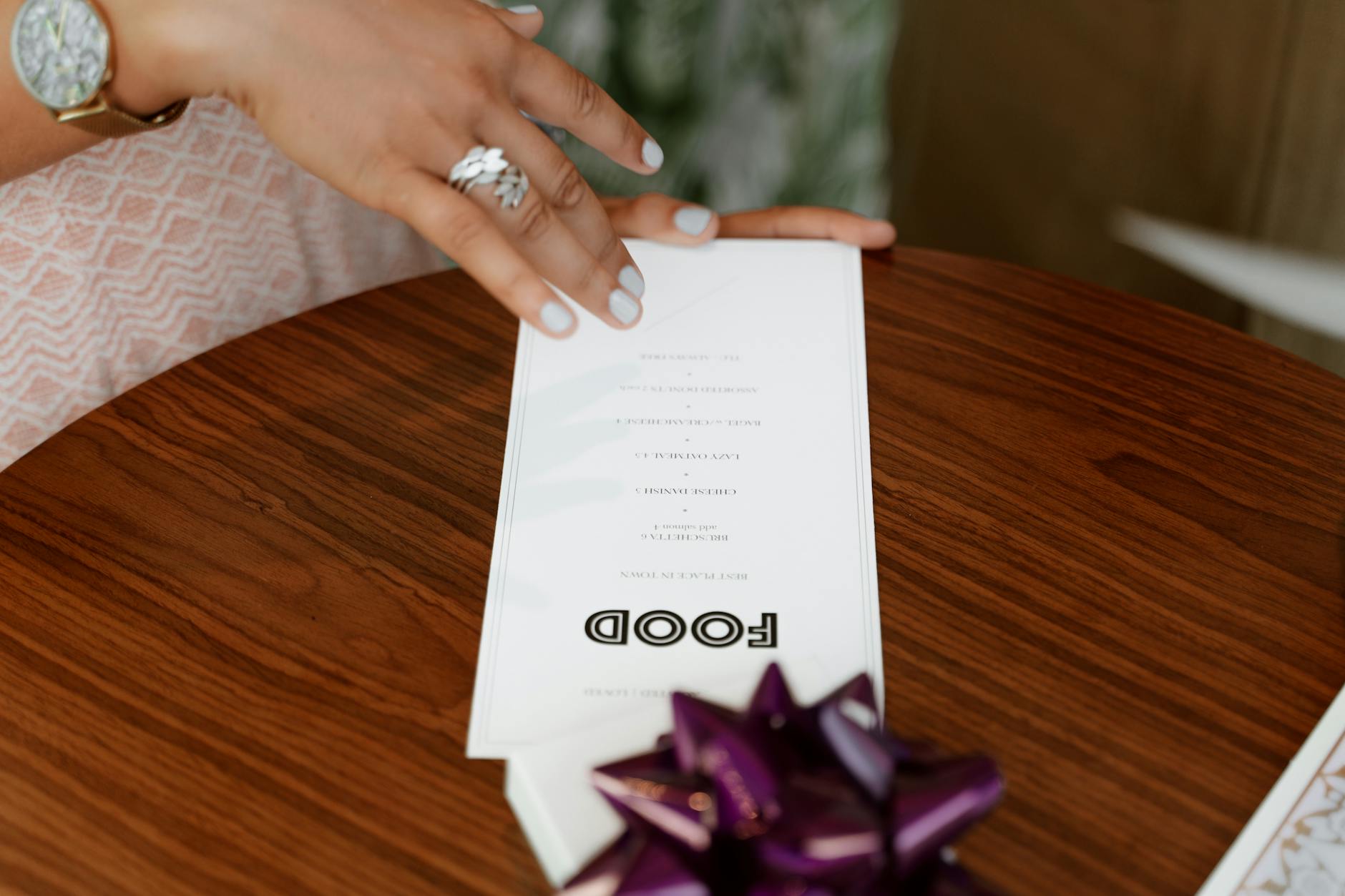 a printed menu standing on a wooden restaurant table