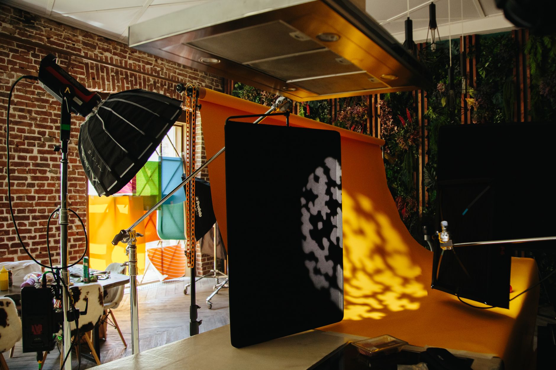 a branded stretch fabric media wall backdrop at a corporate product launch with a presenter in front