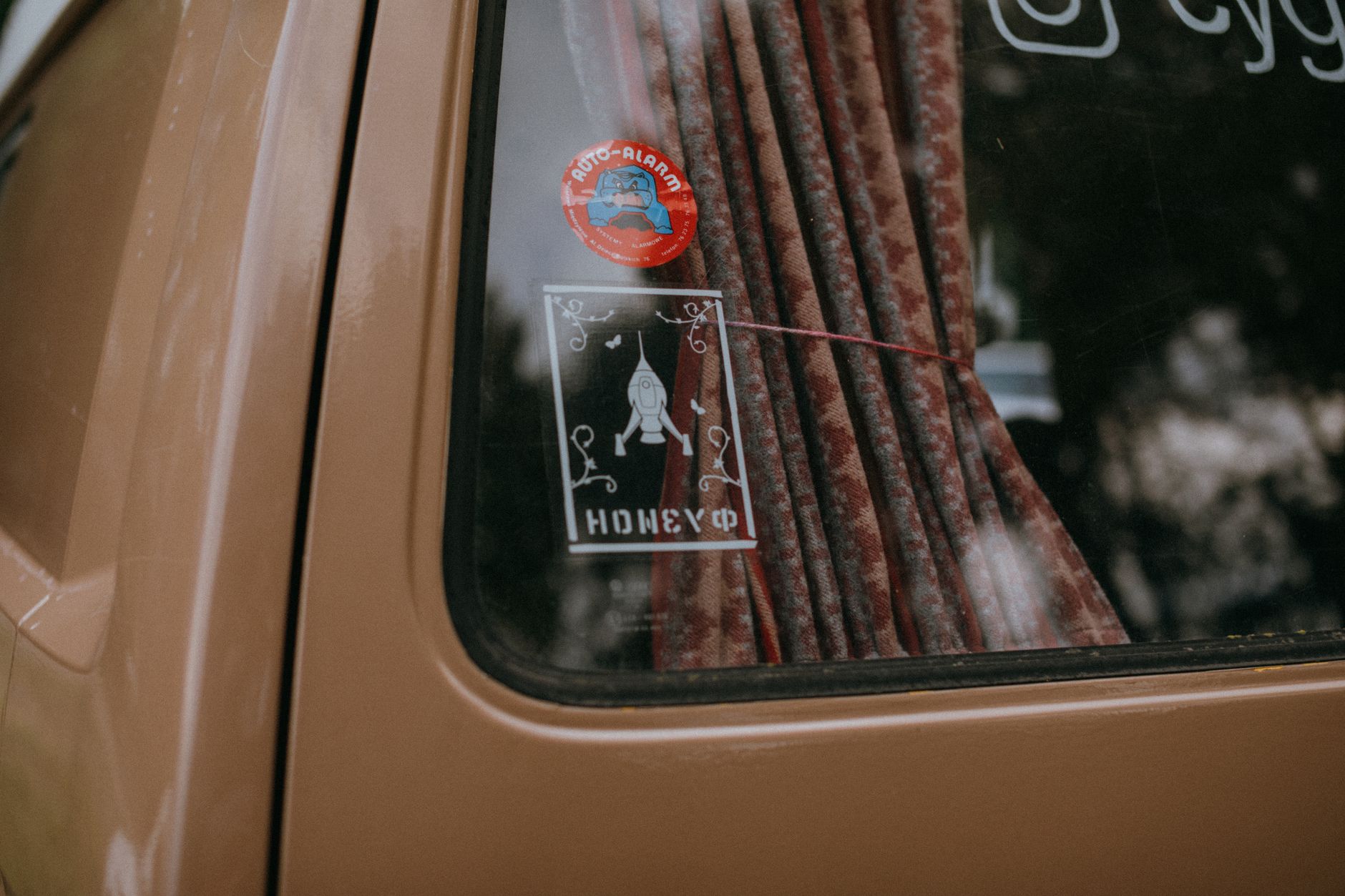 decorative stickers adhered to a vehicle window