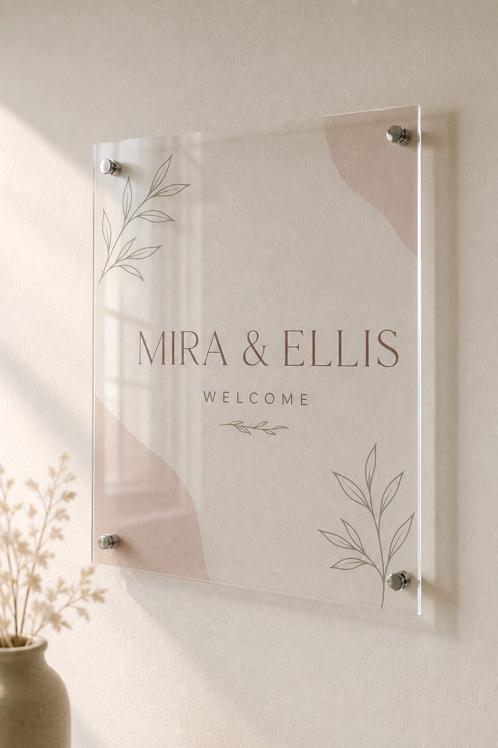 Acrylic welcome sign · clear cast acrylic · digital print · chrome standoff fixings · soft drop shadow on wall