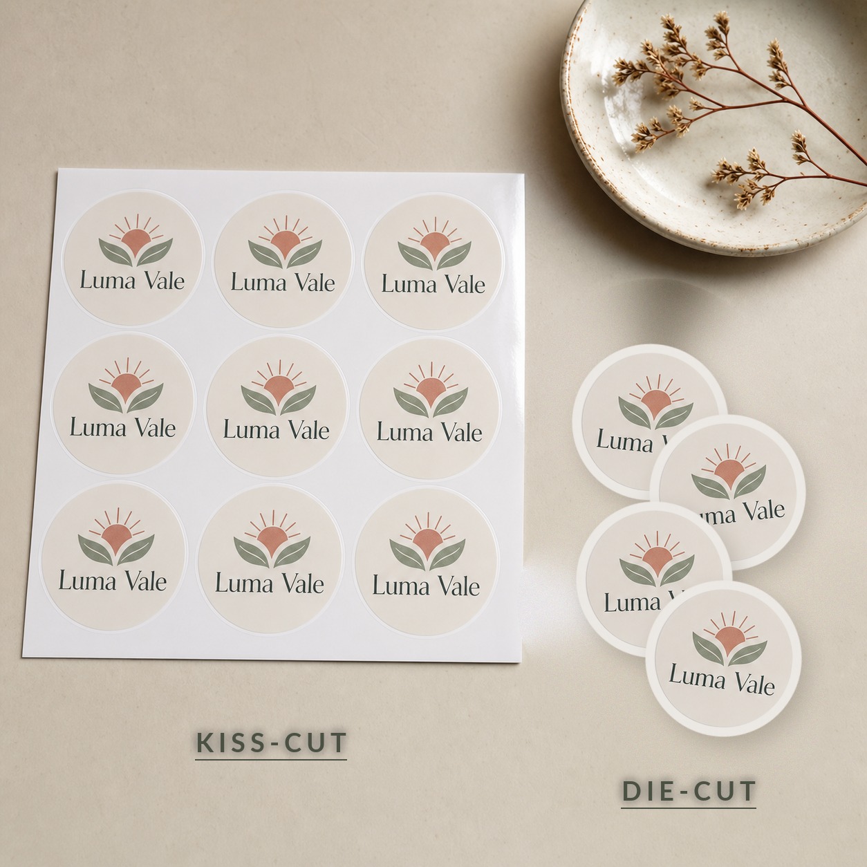 Kiss-cut and die-cut versions of the same Luma Vale sticker side by side: on the left a kiss-cut sheet with the design scored into one shared backing, on the right loose die-cut singles each cut to its own circular contour with a white border.