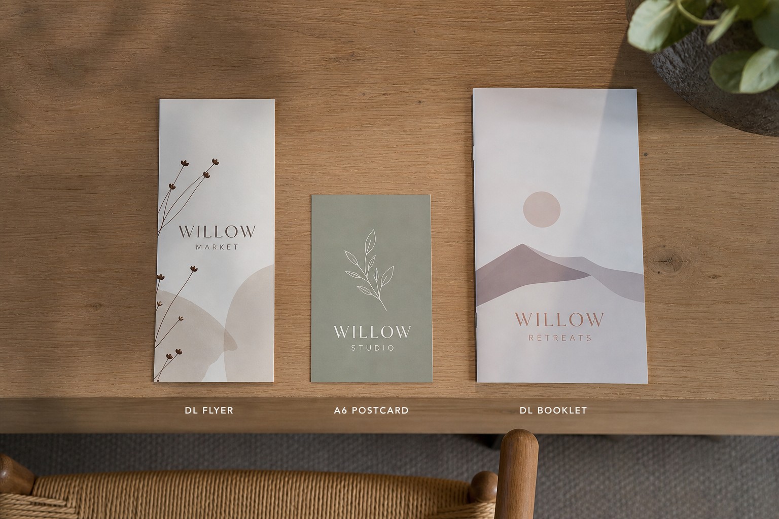 Flat lay on a neutral surface showing three print formats side by side
