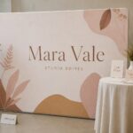 Stretch fabric media wall · 250gsm stretch polyester · dye-sublimation print · matte finish · owned boutique backdrop on an aluminium frame