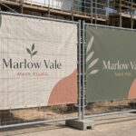 Mesh banner beside solid PVC banner · 300gsm perforated PVC mesh and solid vinyl · full-colour CMYK digital print · reinforced hem binding and eyelets