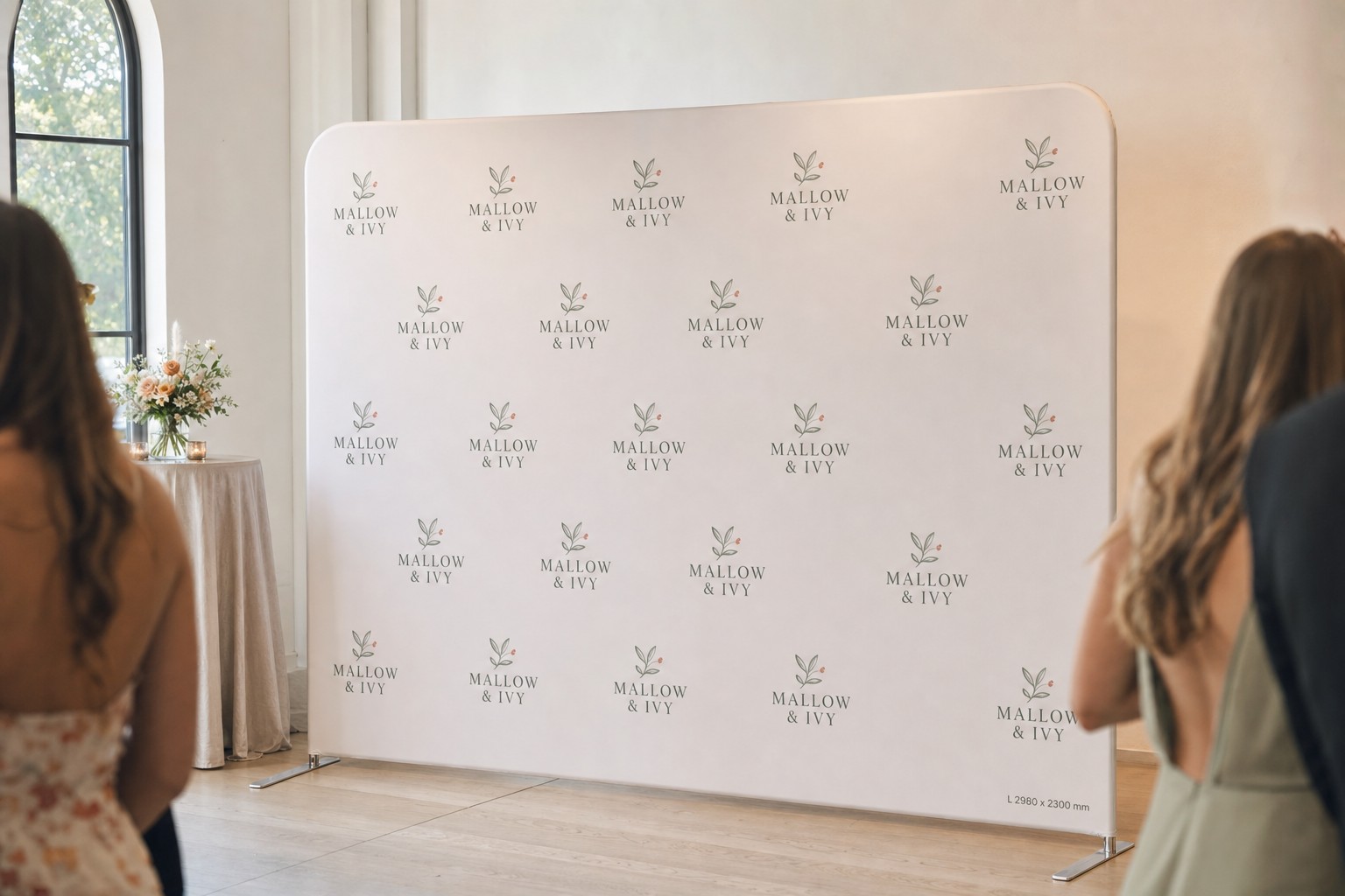 Step-and-repeat media wall · 250gsm stretch polyester · dye-sublimation print · matte finish · aluminium frame on two slim silver feet