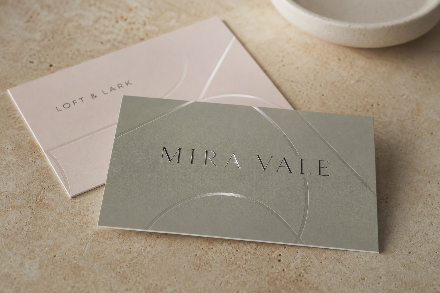 Spot UV business card · 350gsm velvet laminate stock · digital print · flush clear-gloss accent level with the velvet matte