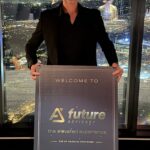 Custom printed Future Advisory welcome sign for the end of financial year event, standing beside the city view windows at Eureka Tower
